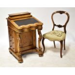 A Victorian walnut Davenport with hinged lid storage compartment to the upper section, above a