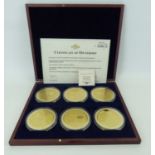 WINDSOR MINT; an Elizabeth II commemorative set of six large gold plated coins/medallions, each