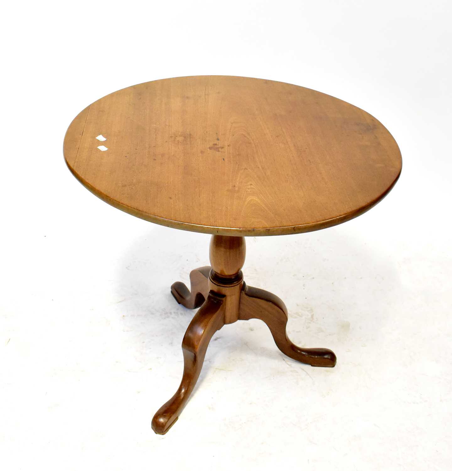 A mahogany circular tilt-top occasional table with birdcage action, raised on turned column and