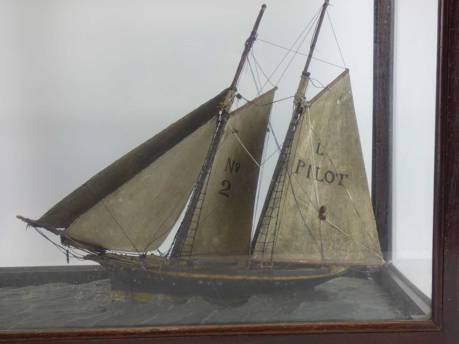 A late 19th/early 20th century wooden model of a two-masted sailboat with 'No.2' to one sail, the - Image 3 of 3