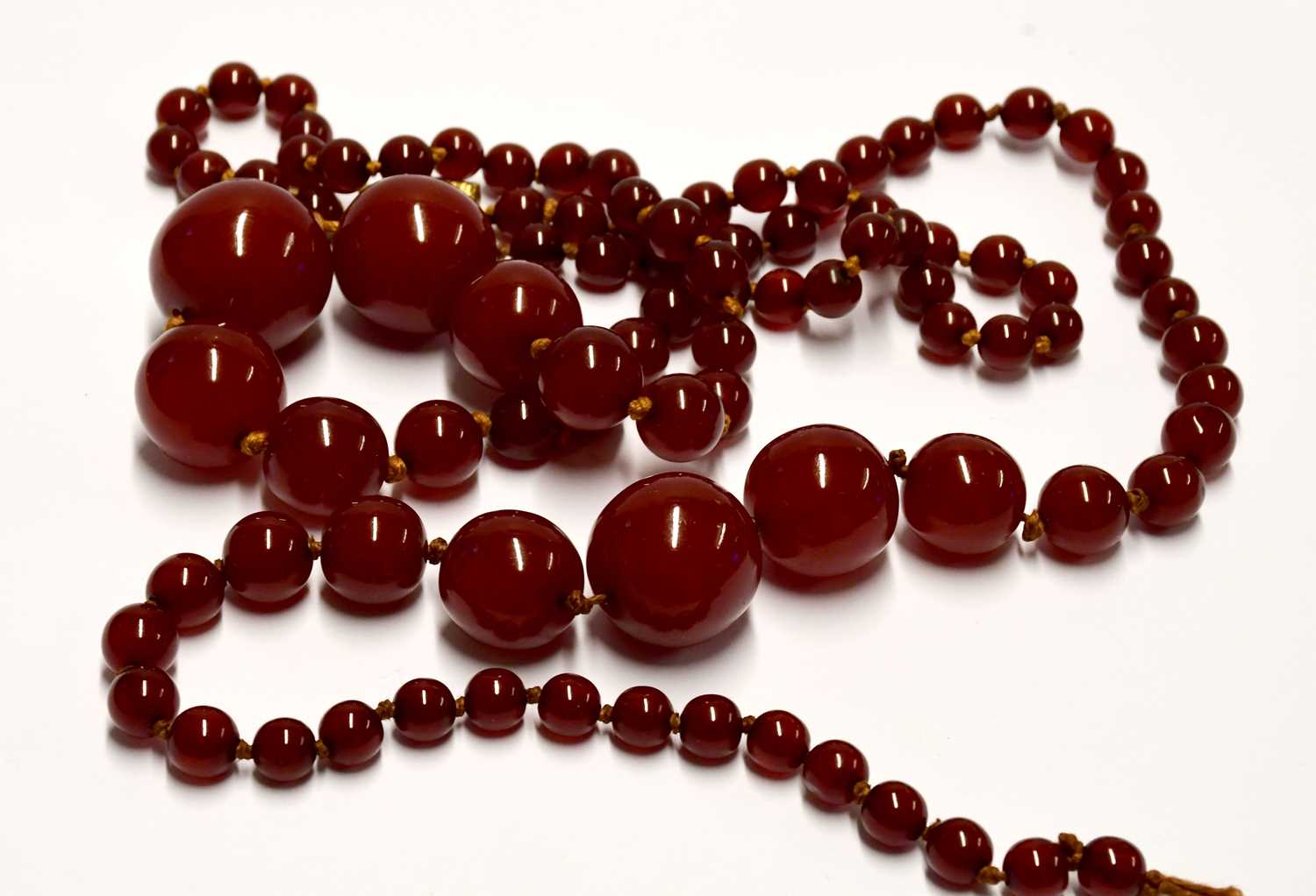 Two cherry amber-style necklaces, one with oval graduated beads, the other with circular beads. - Image 4 of 4