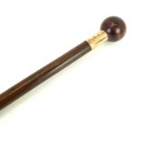 A walking cane with agate ball handle and 9ct gold collar inscribed 'Presented to Neil Bills by