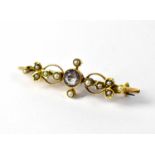 A Victorian 15ct gold seed pearl and amethyst bar brooch, approx. 2.9g.Length approx. 4cm