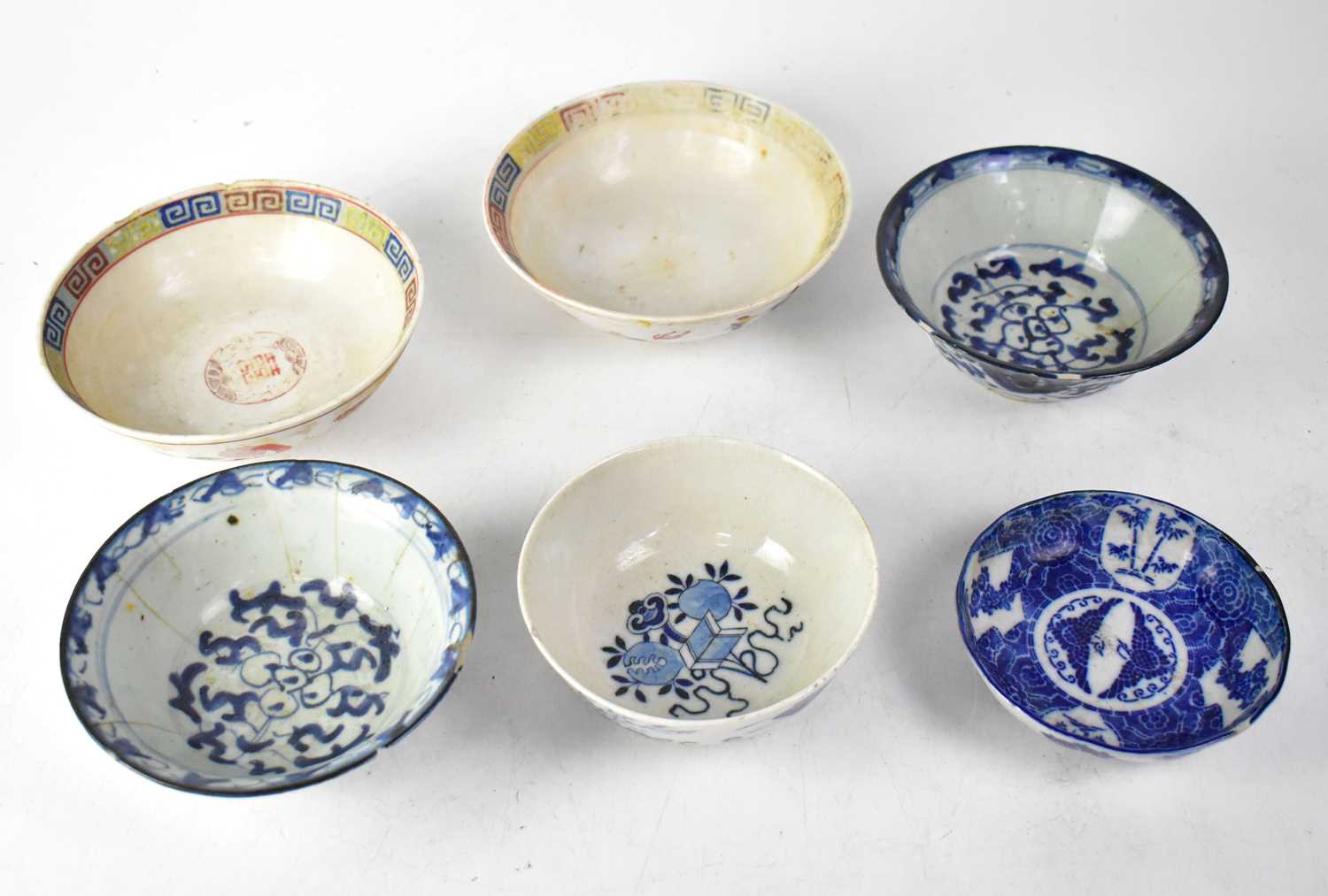 Six 19th and early 20th century bowls comprising a pair of blue and white examples with seal mark to