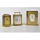 Two modern brass cased carriage clocks by Metamic and Smiths, with swing handles, both battery