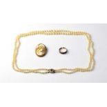 A double string necklace of graduated cultured pearls with 9ct gold pearl and red stone box snap