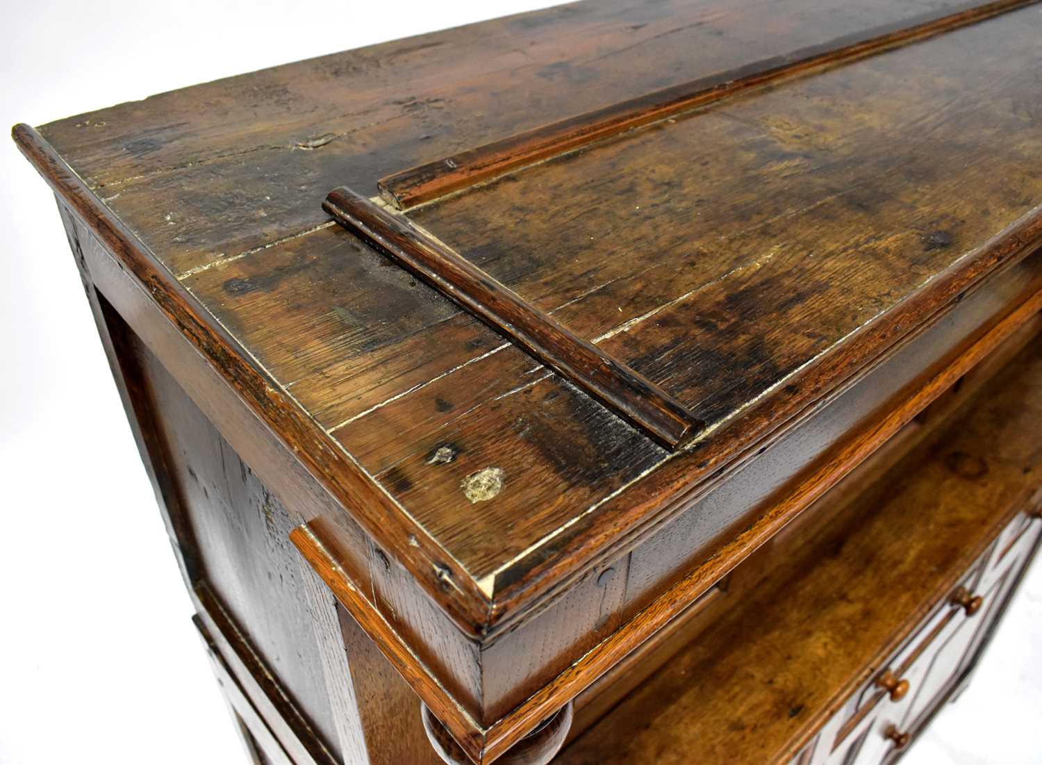 An 18th century oak court cupboard, the upper section with three panelled doors, above a break front - Image 2 of 2