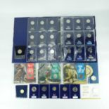 CHANGE CHECKER; an album of uncirculated proof blister pack coins, to include twenty-six 10p coins