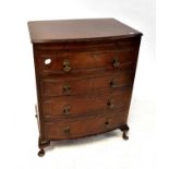 A Georgian-style bow-fronted mahogany bachelors' chest of four graduated drawers with brushing slide