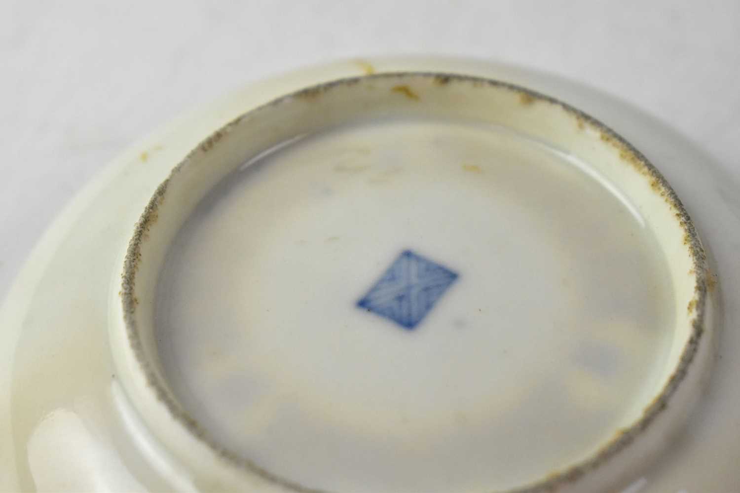 ROYAL WORCESTER; a circa 1760-65 cup and saucer, cobalt blue ground with vignettes of exotic - Image 2 of 3