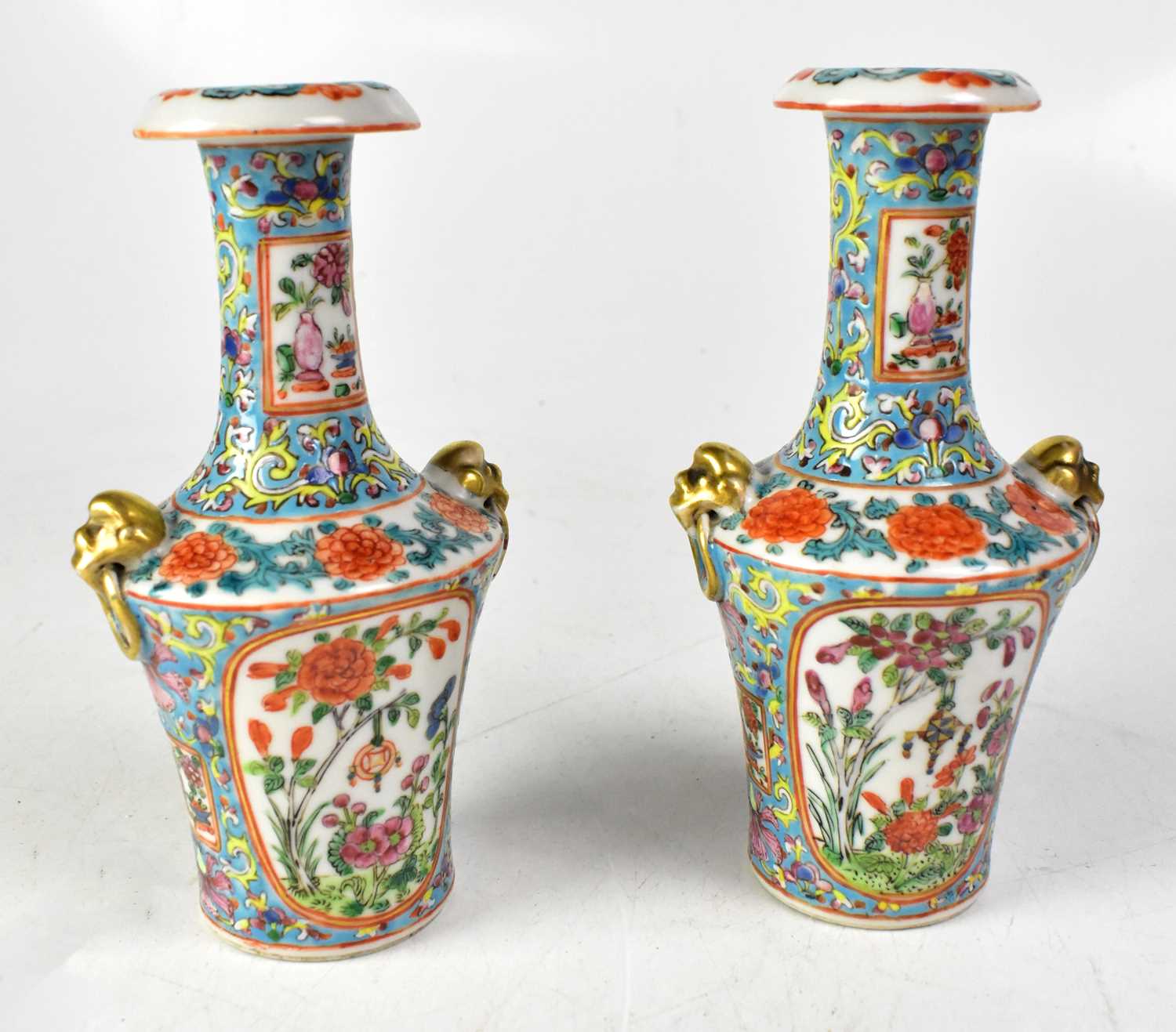 A pair of 19th century Chinese baluster vases with long necks, in the Famille Rose palette,