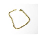 A 9ct gold bracelet with hoop clasp, approx. 7.1g.Length 21cm