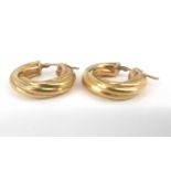 A pair of 9ct gold twist hoop earrings.Dimensions: Diameter 2cmCondition Report: Weight is 4gms