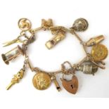 A vintage 9ct gold charm bracelet with six gold charms and eight unmarked charms, including a sports