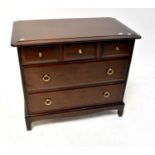 STAG MINSTREL; a mahogany chest of three-over-two drawers to plinth and bracket support.71 x 82 x