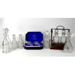A contemporary two-bottle tantalus stamped 'B B & S' and six further cut glass decanters, together