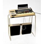 A Sankei Stereo Entertainer comprising a keyboard with stereo radio and cassette player, on a