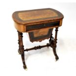 A Victorian burr walnut inlaid sewing table with single frieze drawer above pull-out basket lower