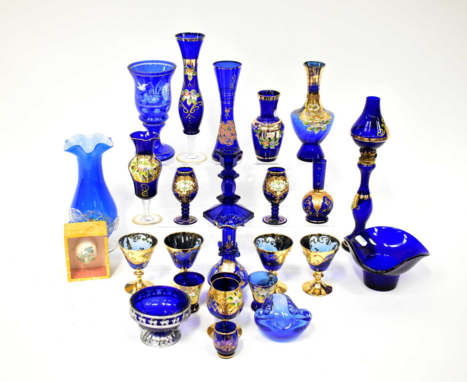 A quantity of blue glassware to include a Murano vase with applied floral decoration, matching and