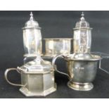 A mixed five-piece hallmarked silver cruet set comprising two similar pepperettes, two mustard pots,