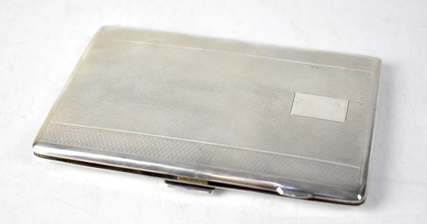 HARMAN BROTHERS; a George VI hallmarked silver cigarette case with engine turned decoration and