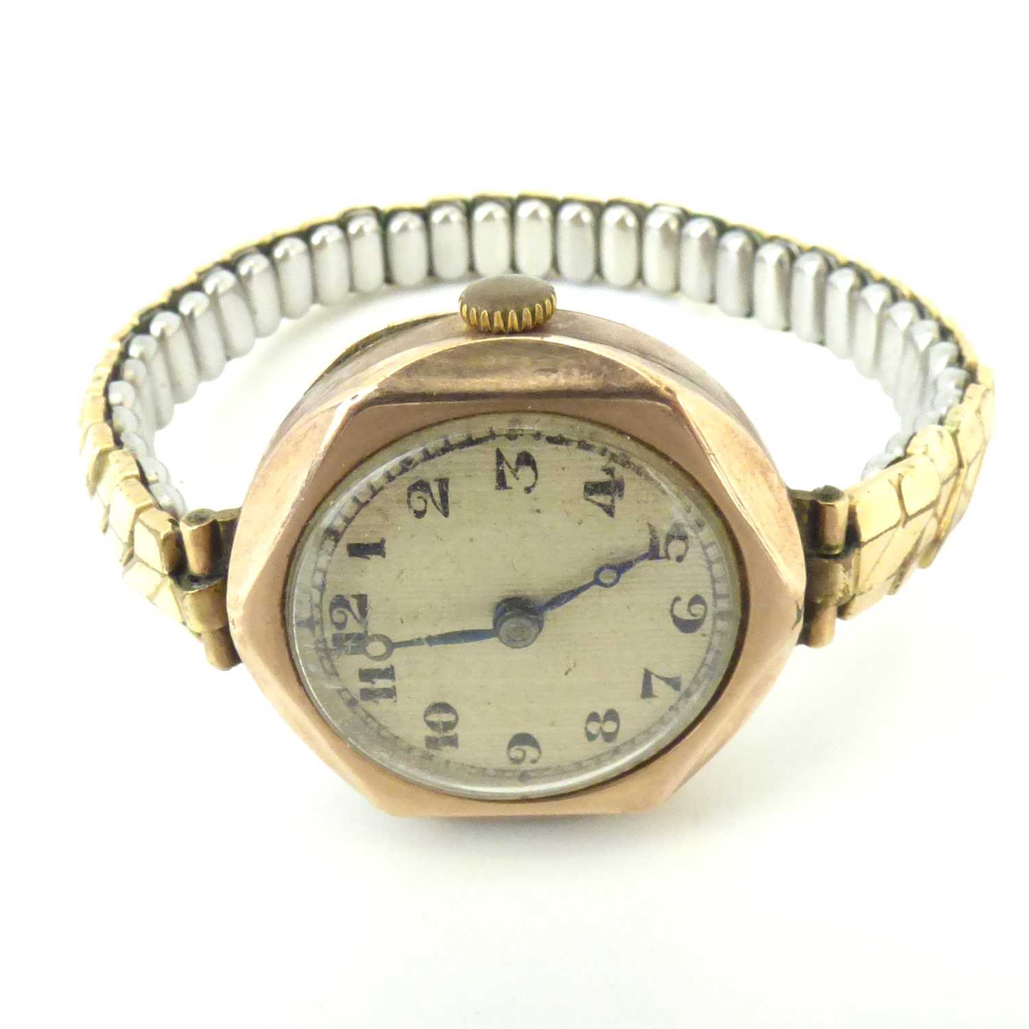 A vintage 9ct gold ladies' wristwatch, the silvered dial set with Arabic numerals, in a 9ct gold