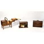 An oak cased Singer sewing machine, one other cased sewing machine and a mid-20th century teak