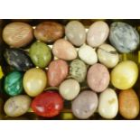 Twenty-two polished agate eggs, various colours and sizes, height of largest 7.2cm, diameter 5.2cm.