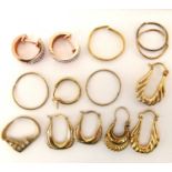 A collection of various 9ct gold and other earrings.