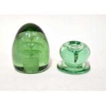 Two 19th century green glass dump-style paperweights, one with internal bubble floral pattern, the