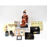 A good quantity of modern Oriental items to include geisha shoes, various tins, prints, a full model