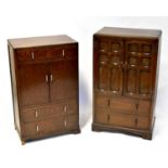 A reproduction oak tallboy with pair of fielded panel doors above a base of two drawers, raised on