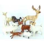 Various porcelain animals to include large and small foxes, a white cat, a Jack Russell terrier, a