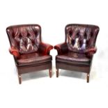 A pair of modern oxblood leather button back armchairs to square tapering supports.Height 94cmQty: