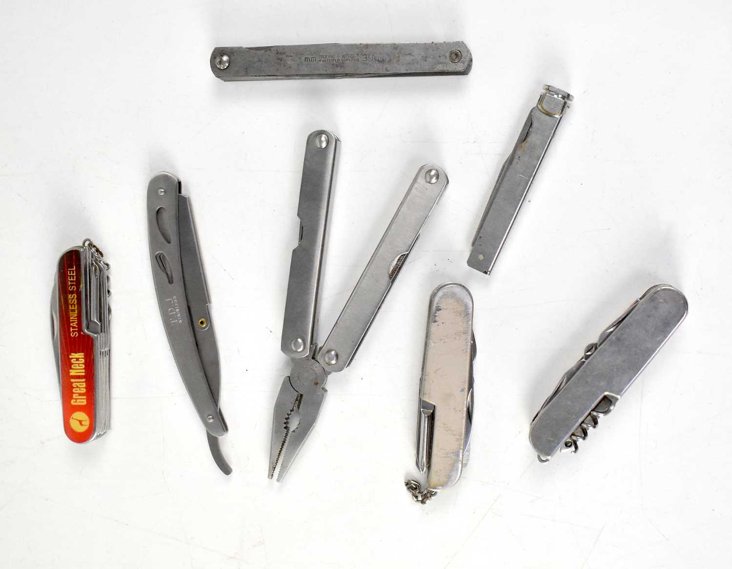 Seven various knives and multitools