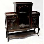 A Victorian carved mahogany display cabinet with central section with three-quarter galleried top