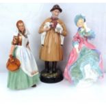 ROYAL DOULTON; three figures comprising HN2057 'The Milkmaid', HN1890 'Lambing Time' and HN1922 '