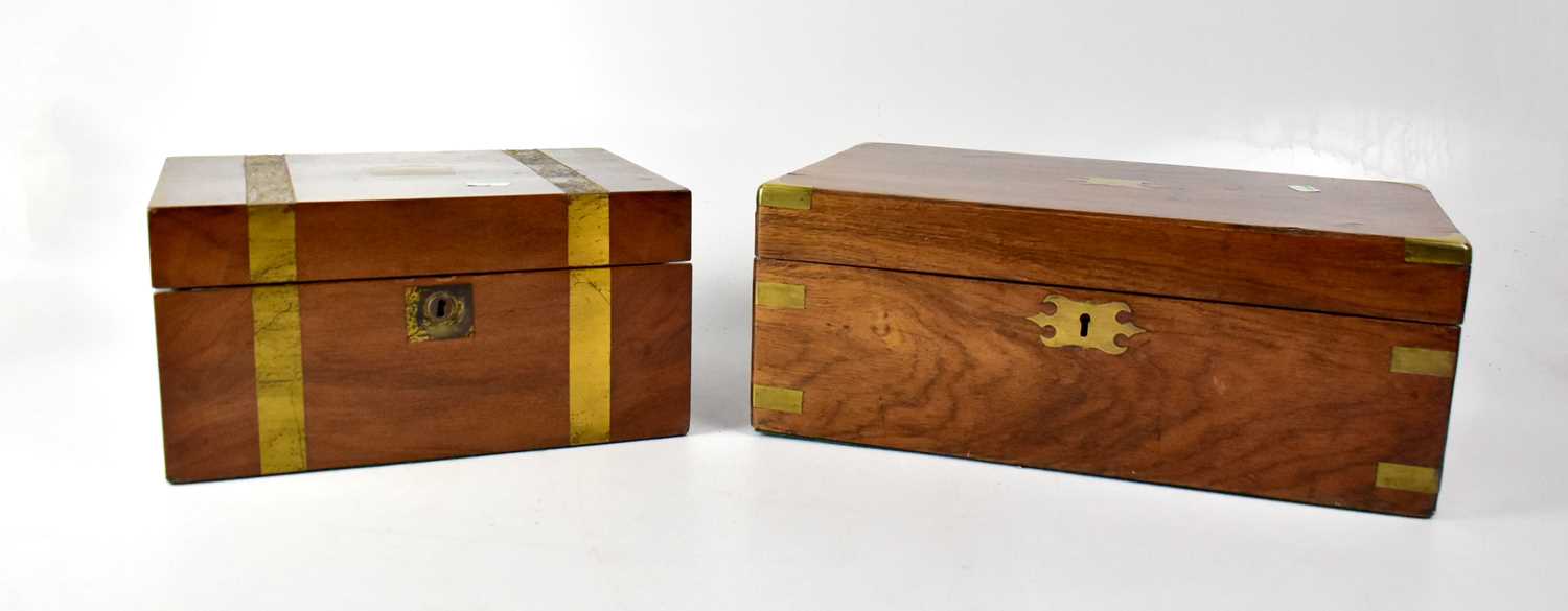 A brass bound walnut writing slope with gilt tooled blue leather inset writing panel, with vacant