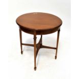 An Edwardian mahogany circular occasional table with satinwood inlaid band to the top, raised on