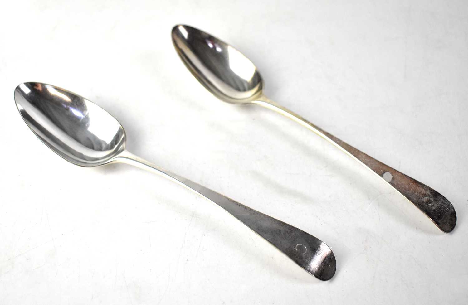 A pair of George III hallmarked silver basting spoons, maker's mark rubbed, London 1788, combined