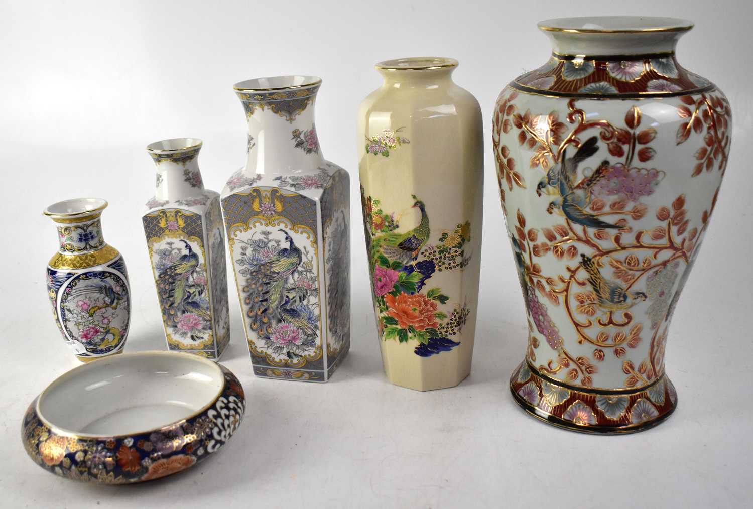 A group of five Oriental vases comprising a Japanese Imperial octagonal vase with polychrome