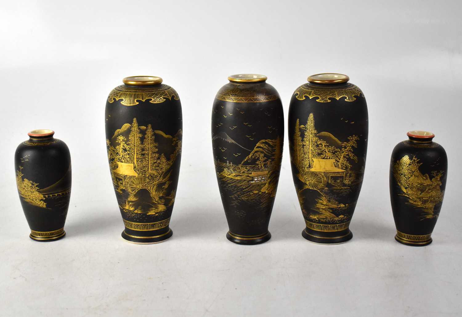 A pair of Meiji period Satsuma baluster vases, matte black ground with gilded decoration of