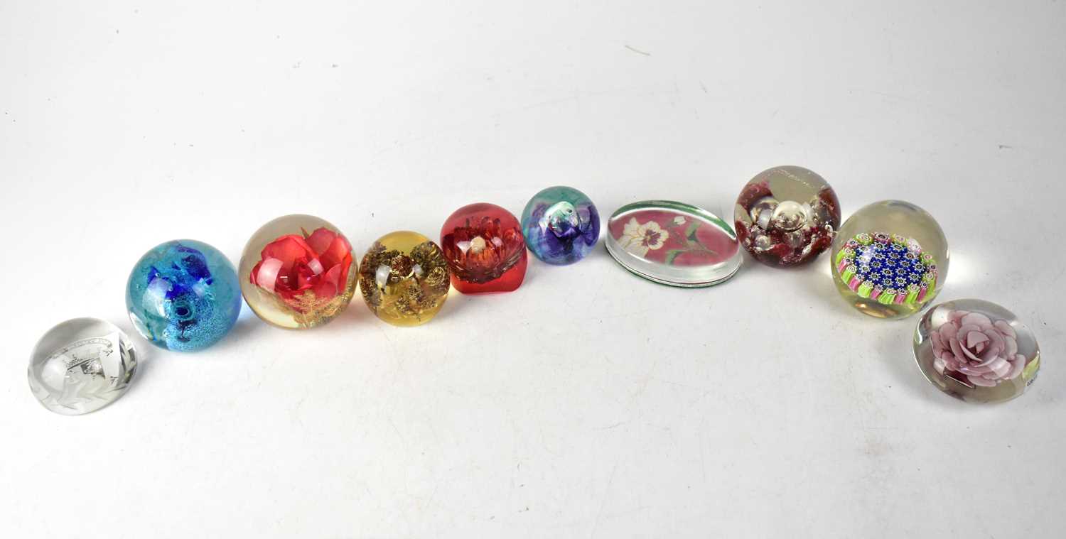 A collection of ten paperweight s to include a Murano Millefiori example, and Edinburgh Armorial
