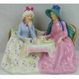 ROYAL DOULTON; a porcelain figure group of two ladies having tea HN1747 'Afternoon Tea'.