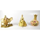 ROYAL DUX; a figure group of a milkmaid leaning on a cow, on gilt base, height 19cm, a further Royal