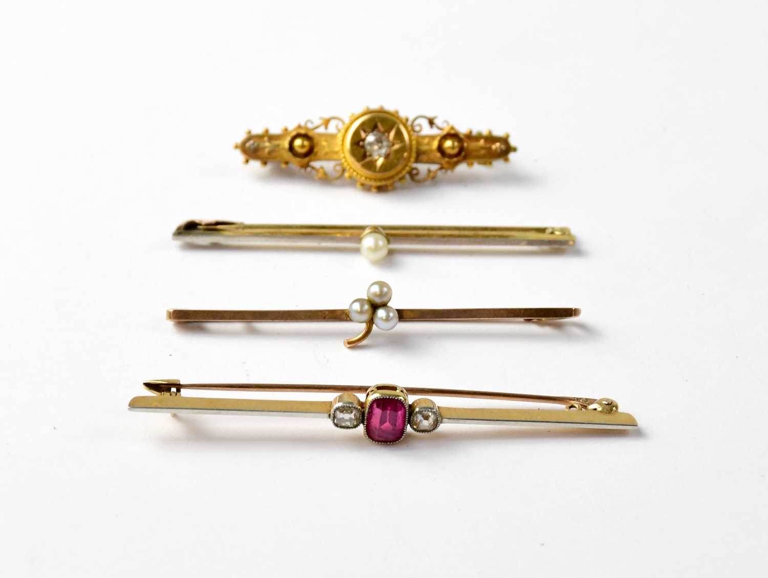 Four Victorian and Edwardian bar brooches comprising a 15ct yellow gold bar brooch with central - Image 2 of 3