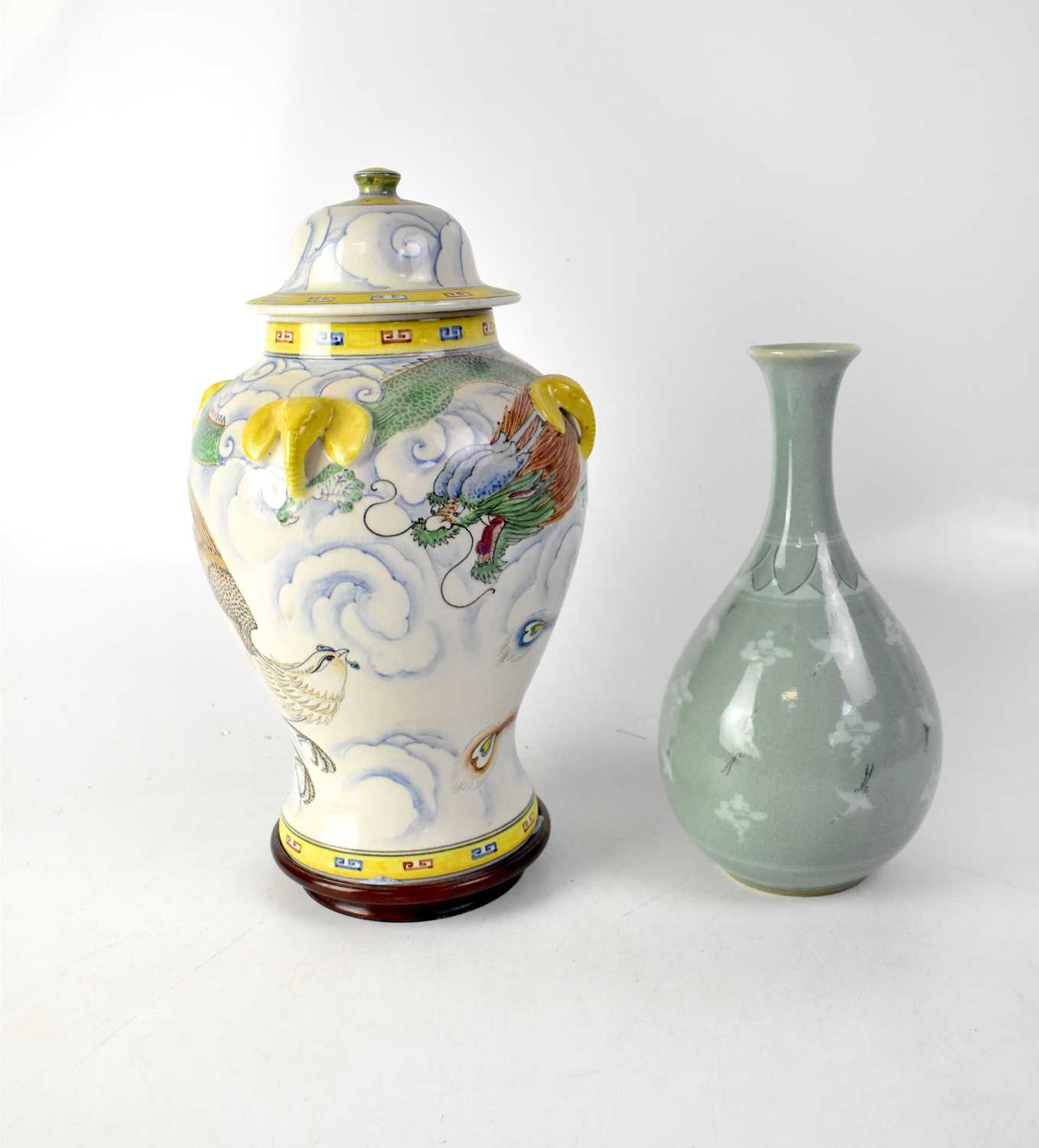 A celadon-style crackle glaze vase of onion form painted with cranes flying amongst clouds, with a