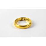 A 22ct gold band ring, size J, approx. 5.7g.