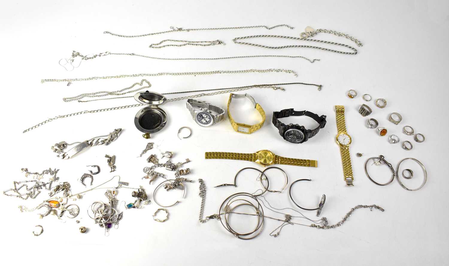 A quantity of silver and white metal jewellery to include bracelets, link chains, rings, charm