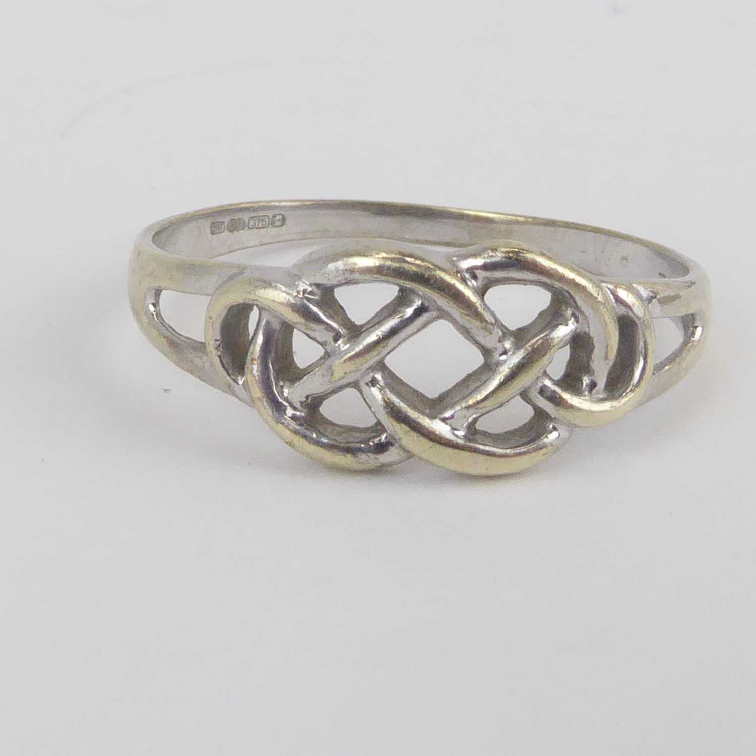 A 9ct white gold Celtic design ring, size Q and a yellow metal eternity ring set with tiny white - Image 2 of 3